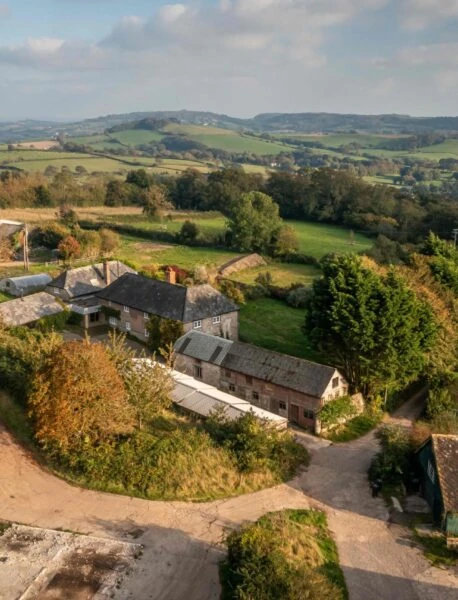 The-farm-buildings-before-restoration-work-began-scaled-458×600